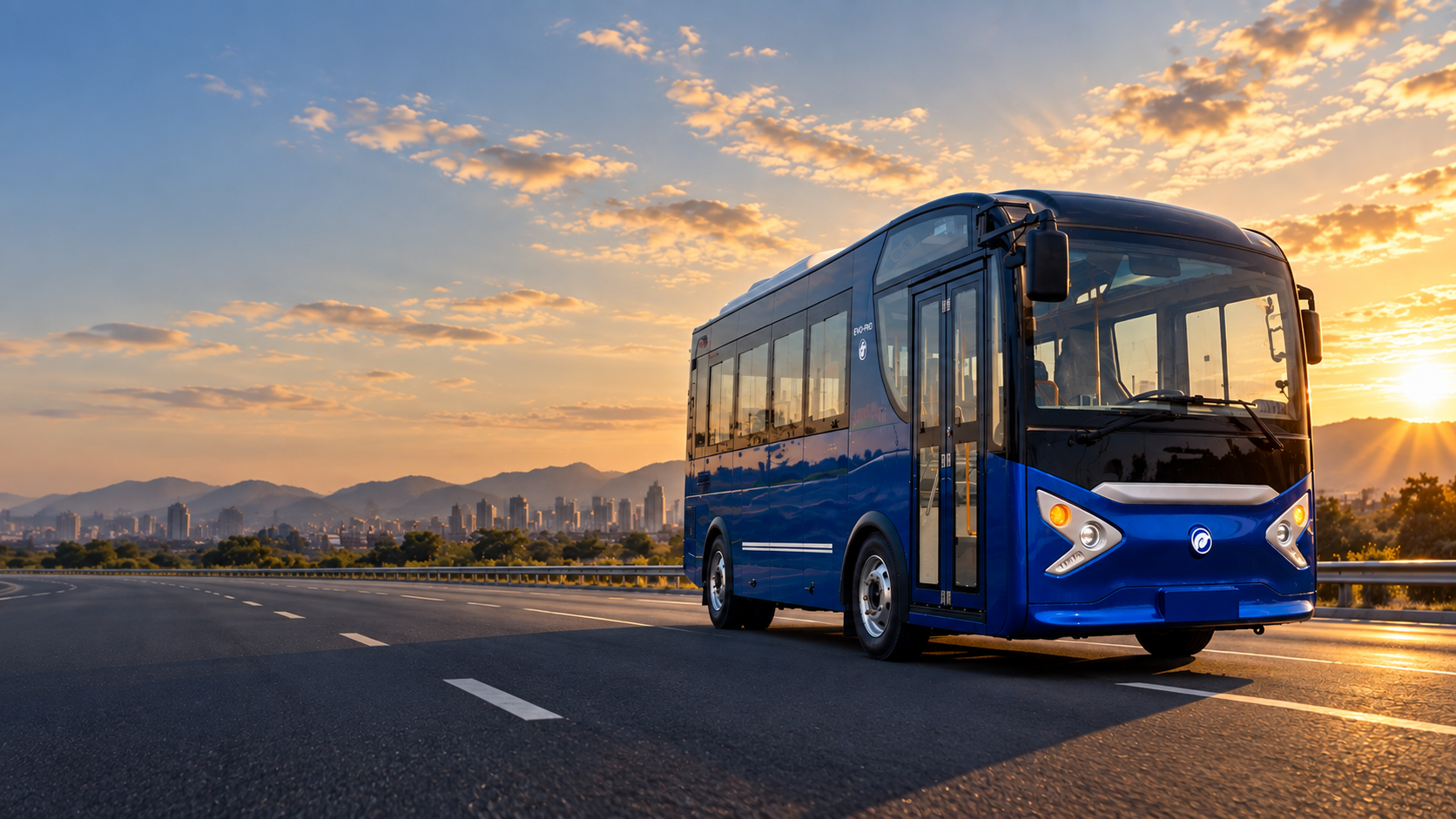 Blue EVO-PRO electric minibus traveling on an open road at golden hour