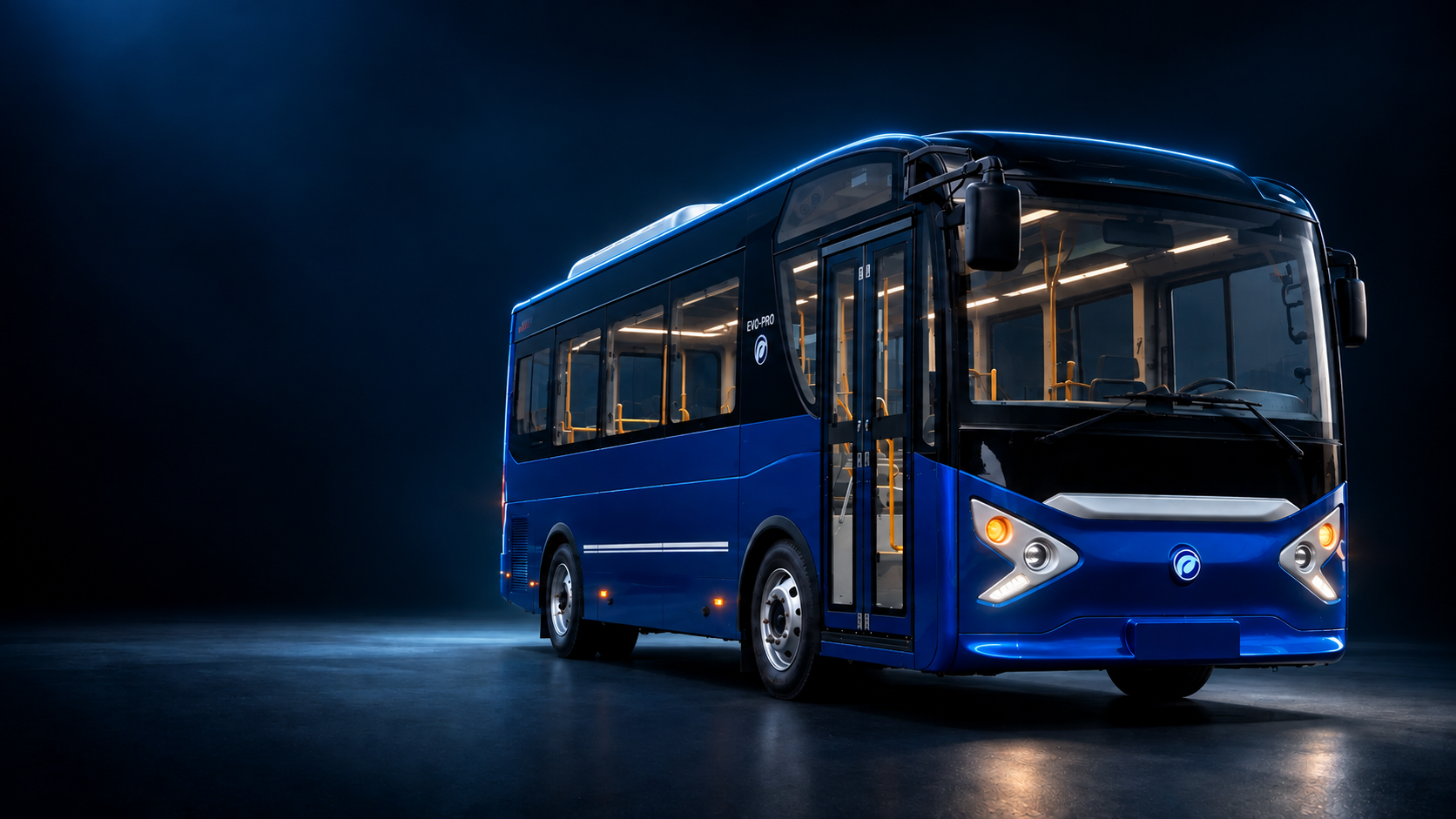 Blue EVO-PRO electric bus illuminated in a dark studio
